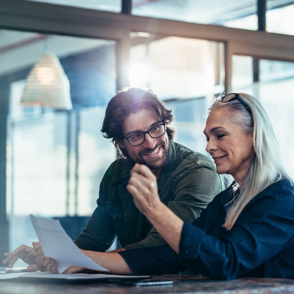 Work colleagues discussing cloud and hybrid applications